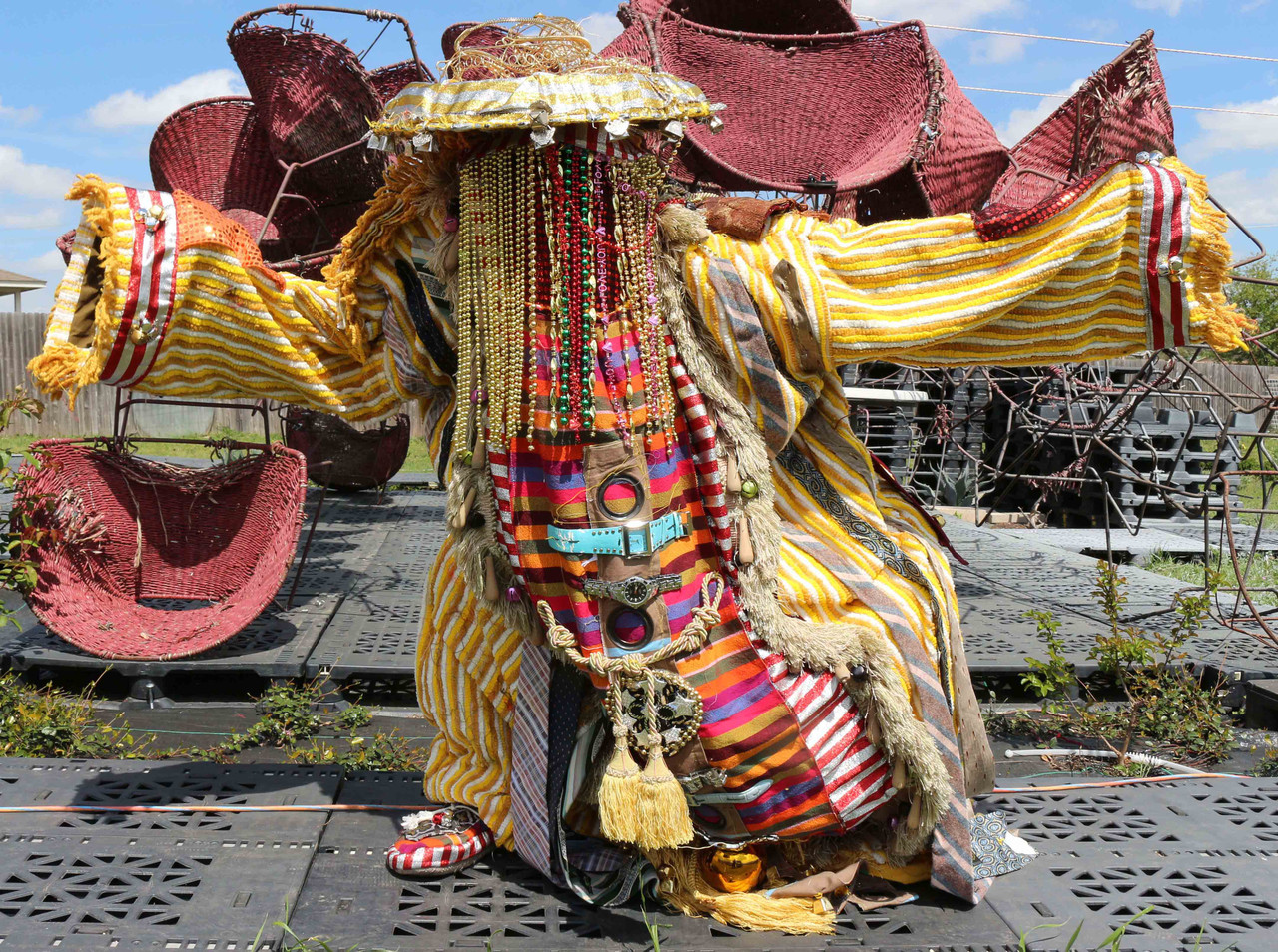 Egun #4, 2018 mixed media tapestry wearable sculpture. 6 x 5 x 4 ft. Materials used are varieties fabric , beads, mirrors, re- purposed like wrist watches, bells, and many more.